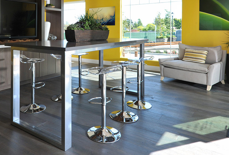 iPad table made of steel and wood. Perfect product for buyers to relax as they learn more about the new home community.